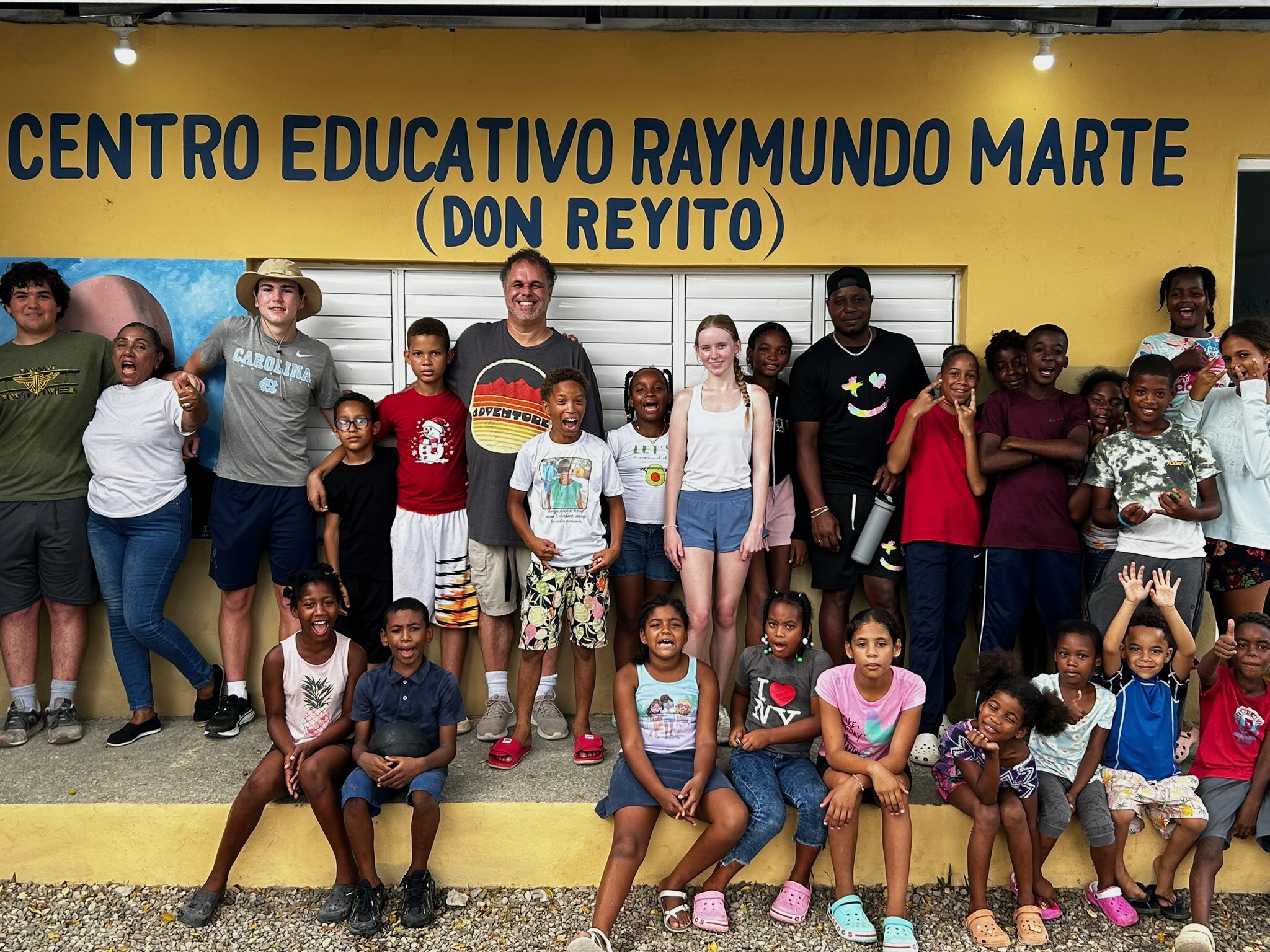 Group of leadership students and children.