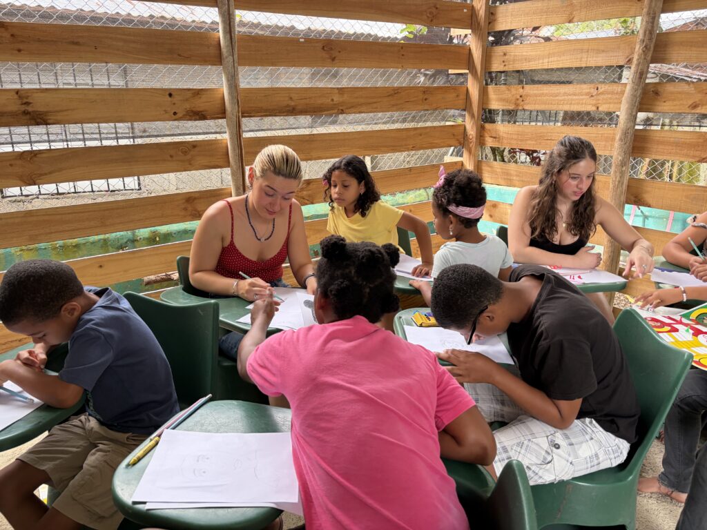 Students working with children.